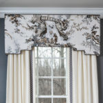 shaped cornice with a black and white toile